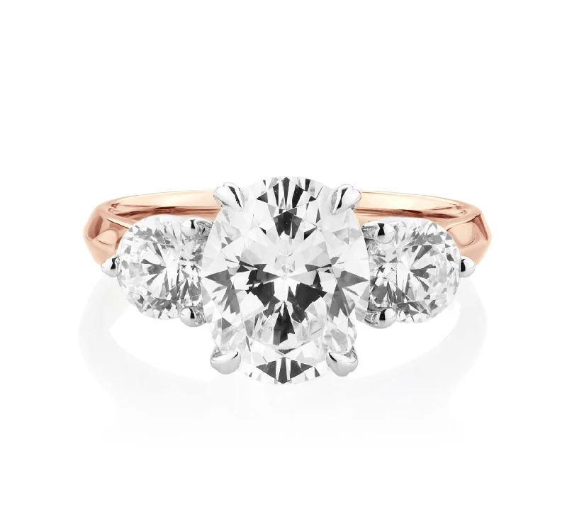 Stackable women rings-Three stone ring with 3.46 carats* of diamond simulants in 10 carat rose and white gold