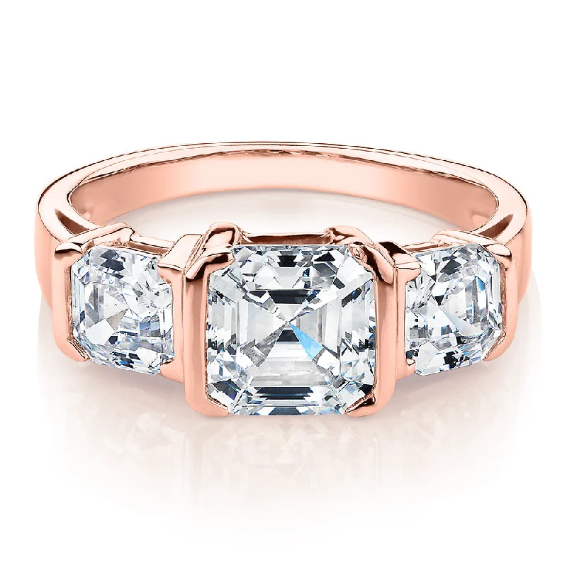 Vintage women rings-Three stone ring with 3.38 carats* of diamond simulants in 10 carat rose gold