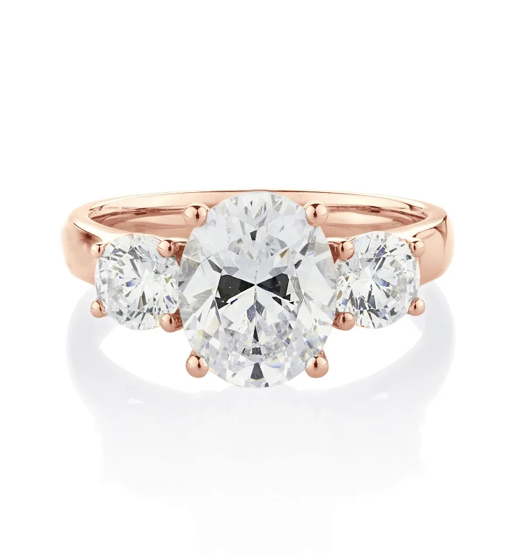 Customizable women rings-Three stone ring with 3.5 carats* of diamond simulants in 10 carat rose gold