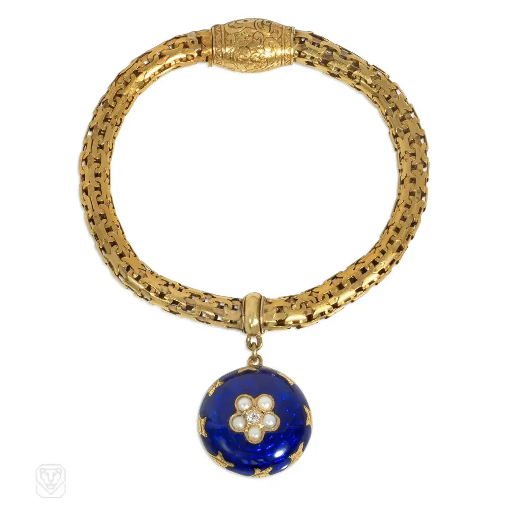 Gemstone bangle bracelets for women-Antique gold bracelet with a blue enamel flower locket