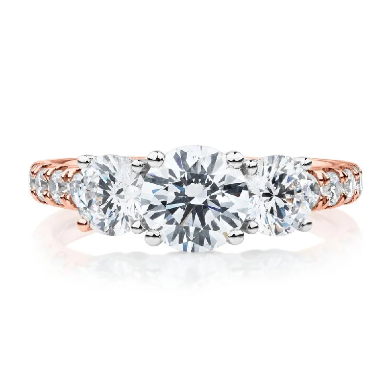 Simple engagement women rings-Three stone ring with 2.19 carats* of diamond simulants in 10 carat rose and white gold