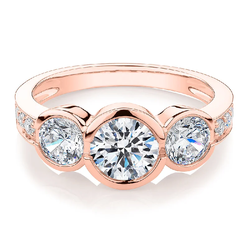 Oval women rings-Three stone ring with 2.11 carats* of diamond simulants in 10 carat rose gold